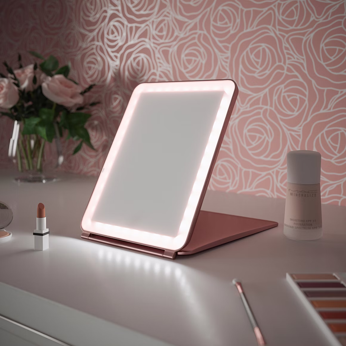 lighted makeup mirror in pink room